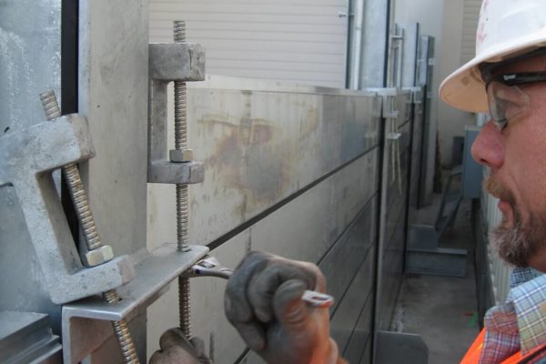 Hold down clamps tighten the flood planks against the horizontal gaskets creating a watertight flood panel.