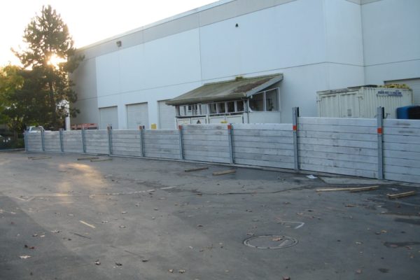 The rear of the building contains a continuous run of the removable flood wall system.