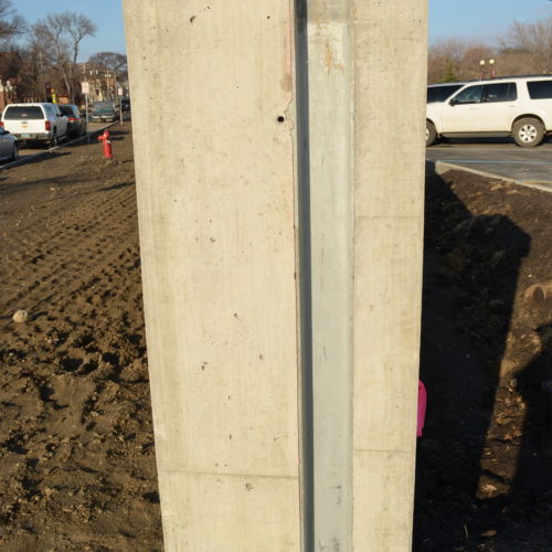 Demountable flood protection barrier embedded vertical channel