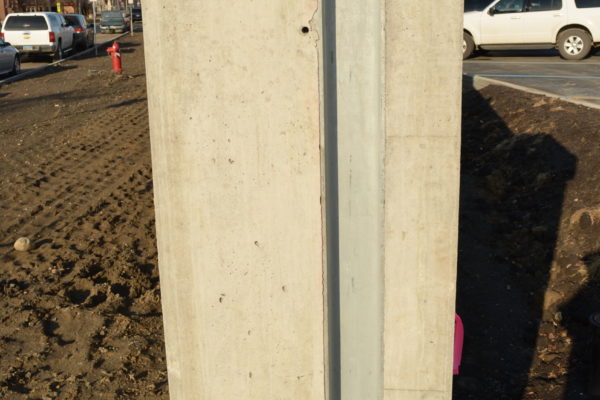 Demountable flood protection barrier embedded vertical channel